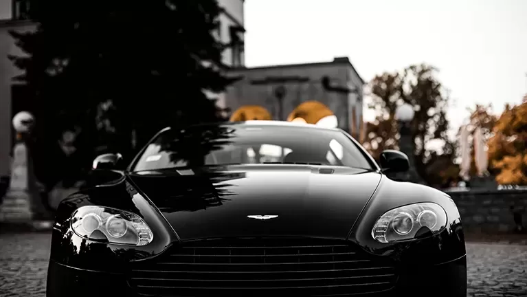 Front of black Aston Martin sports car