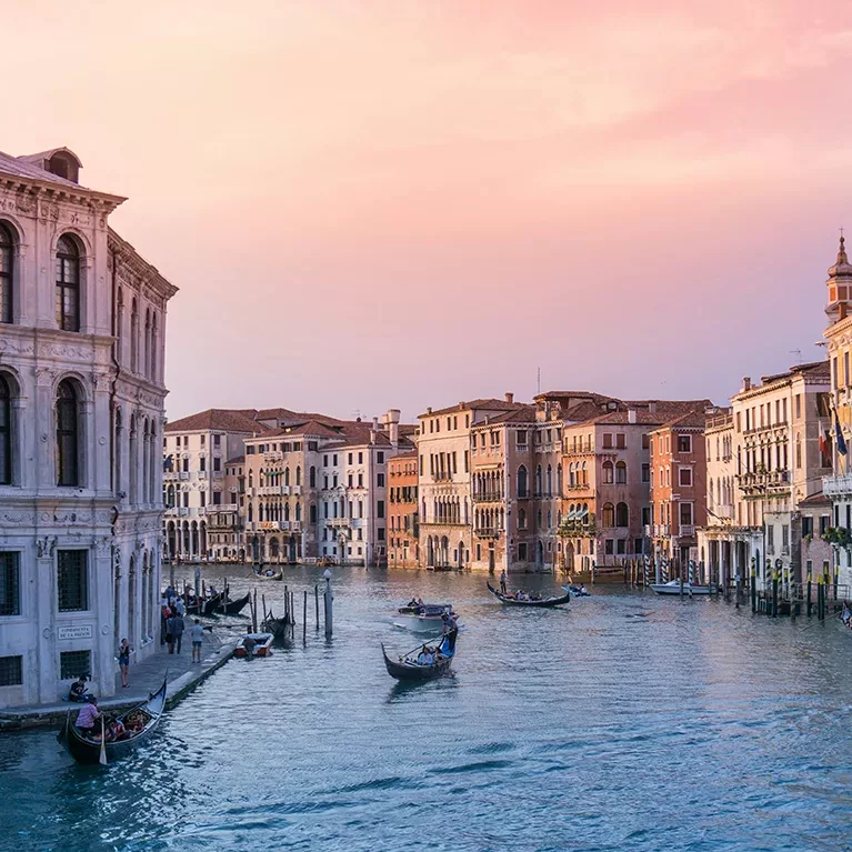 Gondolas glide gracefully along the Grand Canal, showcasing the beauty of Venice's iconic waterways.
