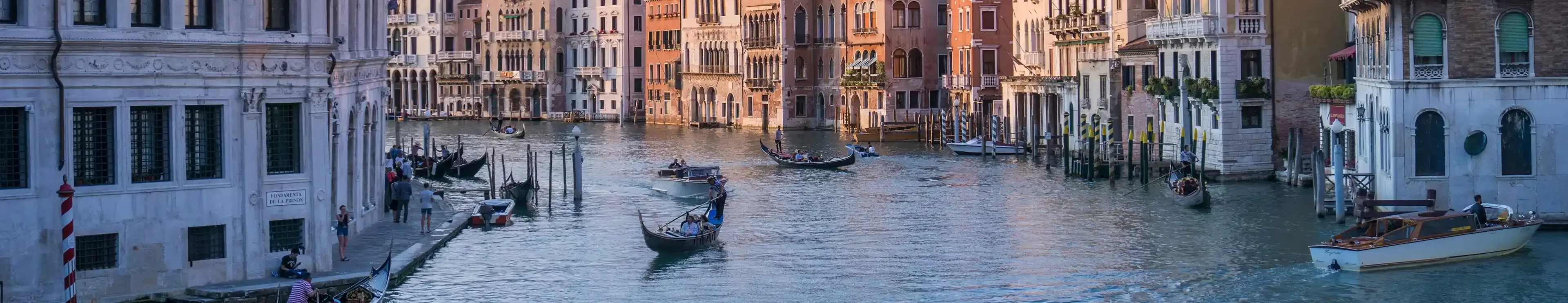 Gondolas glide gracefully along the Grand Canal, showcasing the beauty of Venice's iconic waterways.