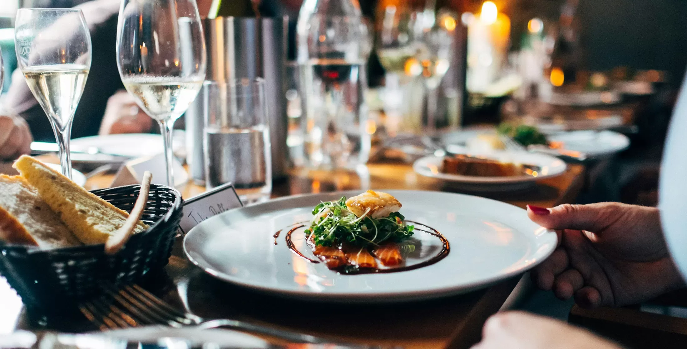 Display of luxury cuisine served on a table with bread and wine