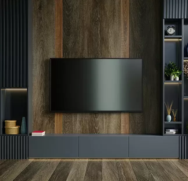 A contemporary entertainment centre featuring wood panelling and a sleek flat-screen television.