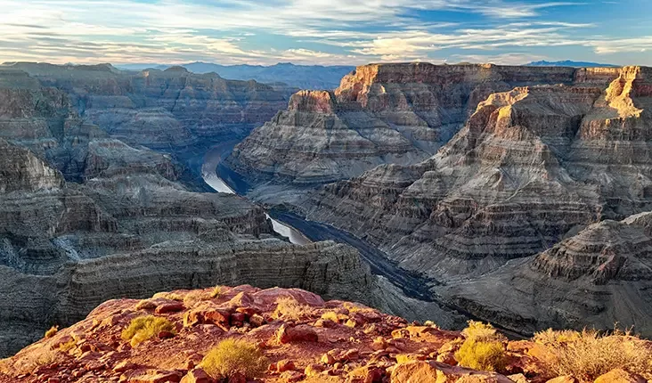 A breathtaking view of the Grand Canyon, a renowned tourist destination in the United States, showcasing its vast landscapes.