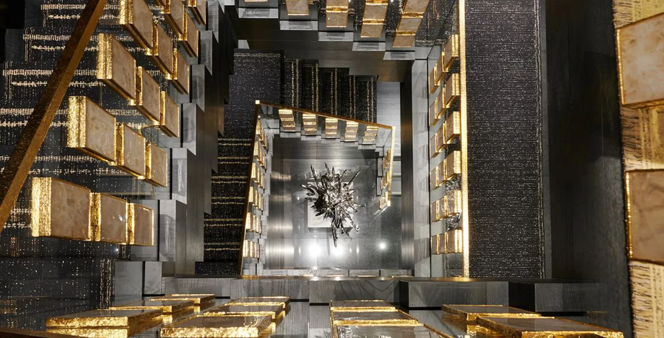 Birds eye view of a black and gold staircase