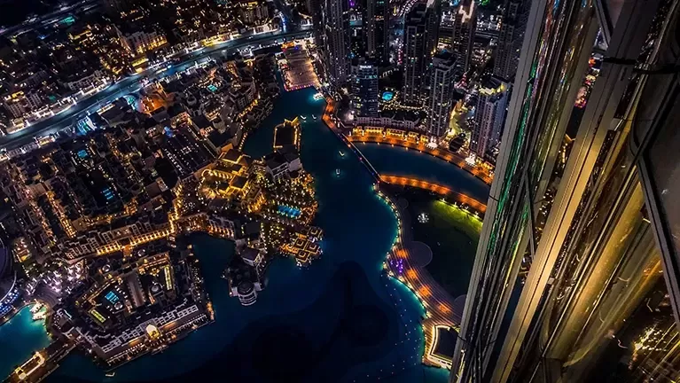 Birdseye view of the city of Dubai lit up at night