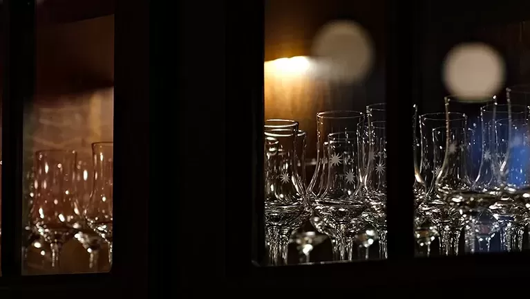 Cabinet of Hennessy glasses.
