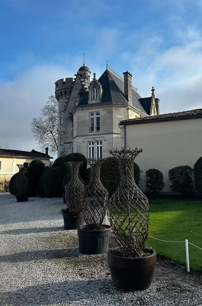 The stunning Château Pape Clément in Pessac, featuring its grand structure and beautifully manicured grounds.