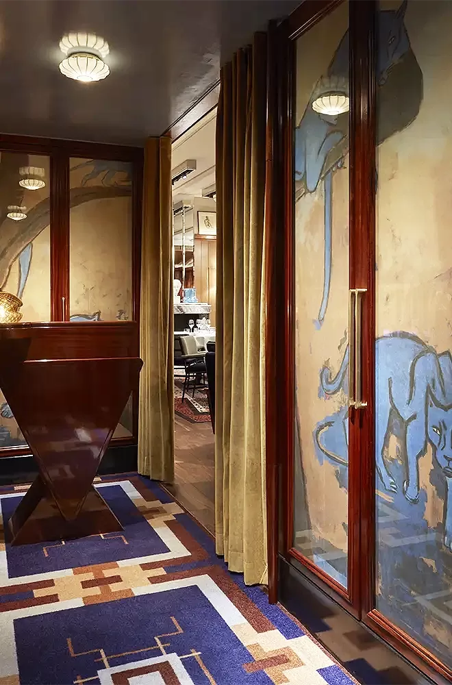 Restaurant reception with leopard painting on the wall of luxury new restaurant Il Gattopardo in London, Mayfair