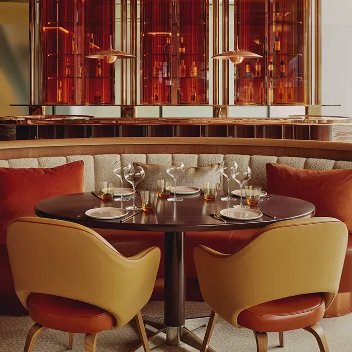 Luxury red interior and cushion seating at abc kitchens at The Emory.