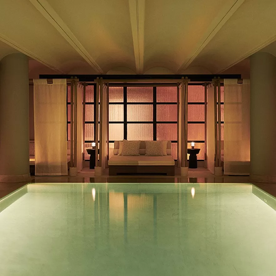 Luxury interior spa pool and double spa pool side bed at Claridges London