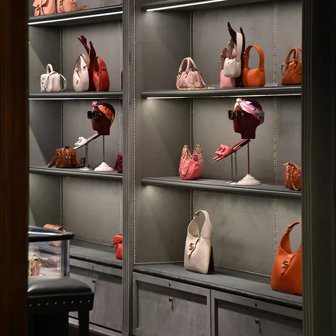 Visual merchandise display of handbags in a boutique