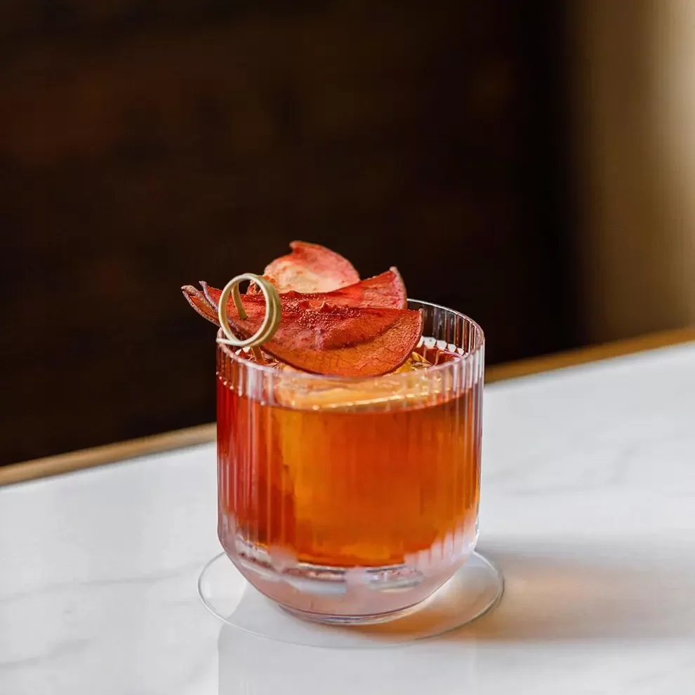 Glass of Abstinence blood orange apéritif with dried orange garnish